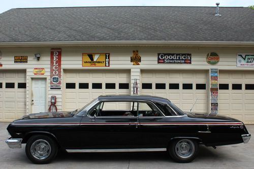 1962 impala......good looking black paint with nice red interior