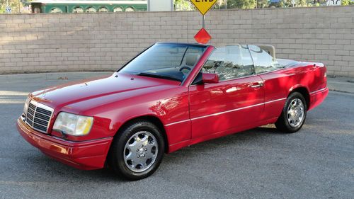 1994 mercedes e320 convertible with 75500 miles, red with parchment. perfect one