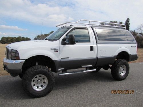 2001 ford f-250 7.3 98k- 4x4 lifted, one of a kind, lots of $ invested! 2 owners