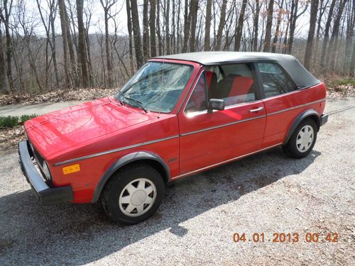 1987 vw cabriolet; red on black, 5 sp 84,000 miles.  very nice classic rabbit