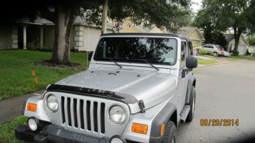 2004 jeep wrangler sport  with  factory hard top