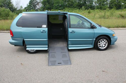 Handicap accessible minivan wheelchair powered ramp, lowered floor transfer seat