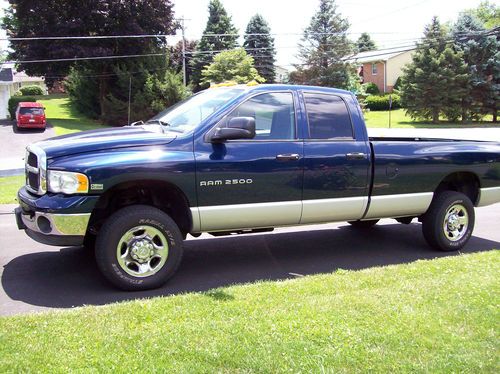 Dodge 2500 4 door 8'bed blue and silver 4x4