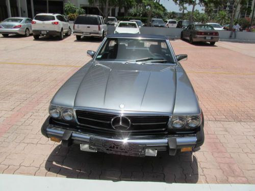 Blue gray 1988 560 sl. 88k miles cold air new top, tires, battery. engine = 10