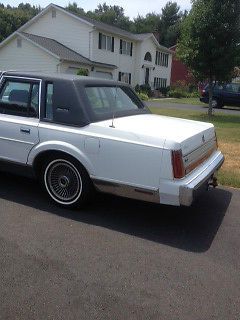 1988 white 4 dr, power locks,windows, new tires, nice cond, 60k miles, $2500