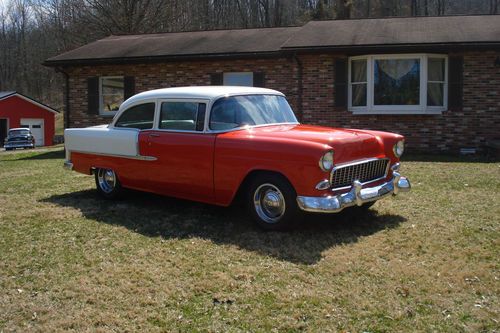 1955 chevy 2 door sedan- 210, orange metallic/ ivory 2 tone ext, white interior
