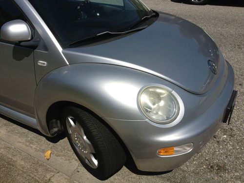Vw new beetle. silver. 60k miles only. nice car. clear title