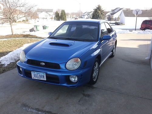 Blue subaru wrx - runs great. with top of the line dvd/navigation system