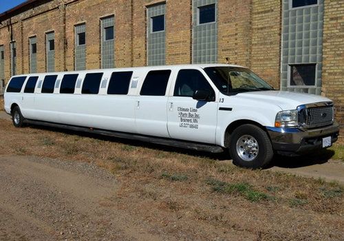 2000 white ford excursion - seats 24 - 220  inches in length - new paint job