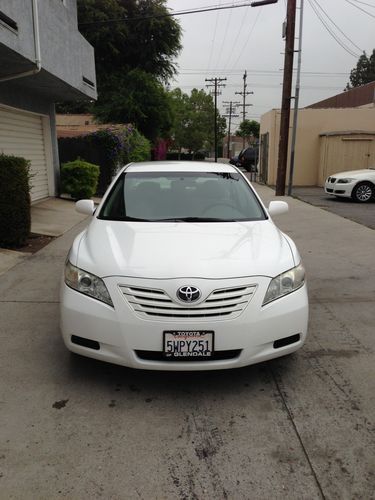 2007 white toyota camry le with extended warrantly