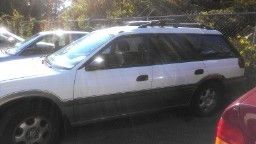 Subaru outback, 1999 white, 4 doors, 4 cylinders, air conditioning!