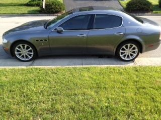 Grey 4 dr sedan in great condition with low mileage.