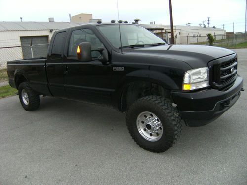 2003 ford f-250 super duty super cab in excellent condition!!!!!!! black beauty!