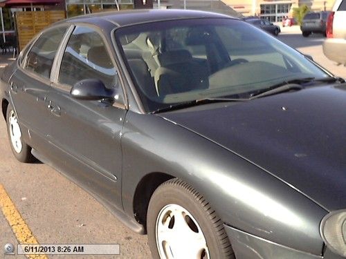 1999 dk green ford taurus se 3.0l drives ok  automatic 4-door --only $870