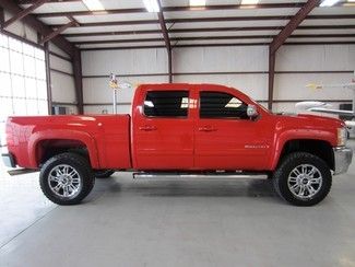 Red crew cab lifted 6.0 gas warranty financing chrome 20s new tires extras clean