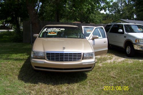 1998 verry clean ice cold air...cadillac   deville....saints gold.