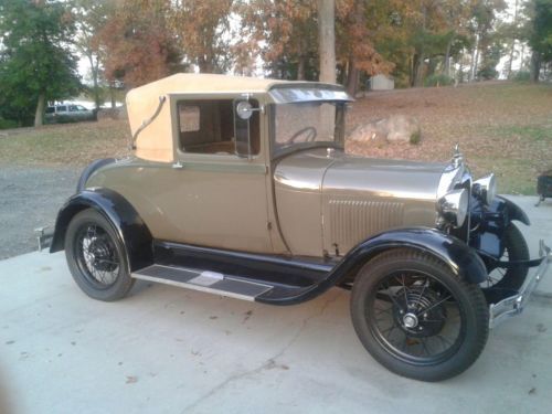 1928 model a ford, sport coupe, older restoration, very good cond, come drive.