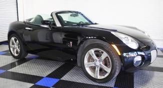 Mysterious black convertible sports coupe roadster chrome rims leather low mile