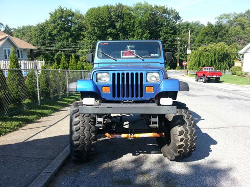 Blue customized 1995 jeep yj with 15-16/5-39.5tsl. with hard top, soft top,