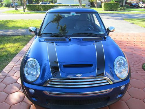 Hyper blue metallic paint exterior with custom stripes and black interior. 6 spd