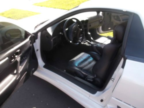 White with black leather interior, automatic, sunroof, power seats, cd changer