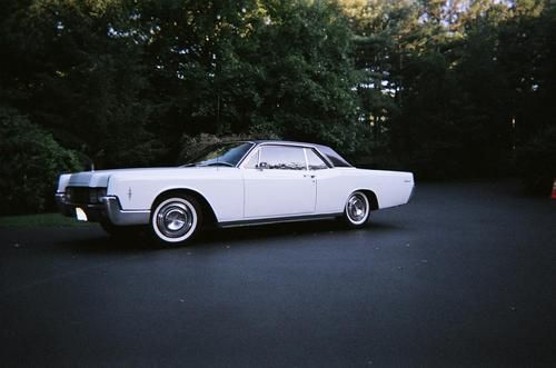 Lincoln continental 1966 coupe white with black vinyl top and black interior