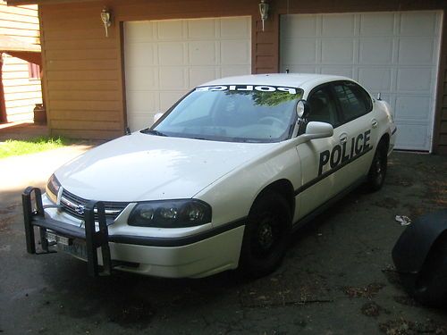 White, excellent condition, all the equipment needed for a police/security car