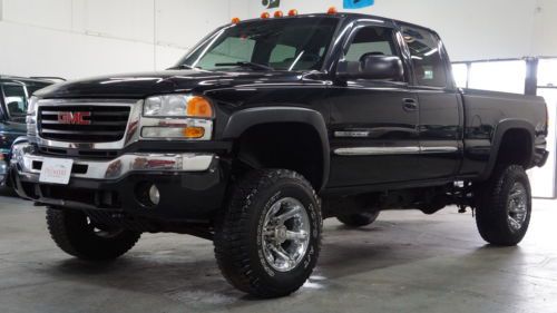 Clean carfax 4x4 6.0 v8 ext. cab! lifted mud tires headers &amp; exhaust*  50+ pics