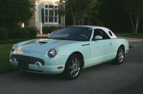 2004 ford thunderbird convertible, green with white hd top, blck leather seats.