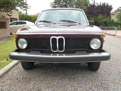 Solid original cosmetically restored 2002 bmw. maroon base coat-clear coat paint