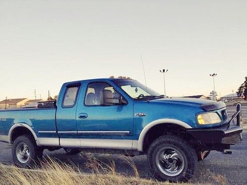 1997 ford f-150 4x4 with 4" lift and large grill guard. needs work. *no reserve*