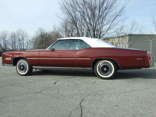 : convertible, power top, one family owned, 703 orig. miles, a/c,leather,last yr