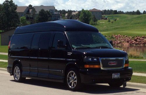 9 passenger,totally blacked out w/ ground effects, all black leather interior.