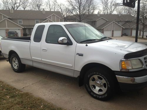 White, automatic, 6 cylinder,  long bed, 155,750 miles, one owner