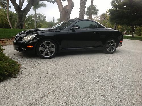 2006, black with ecru leather, 36k miles, like new