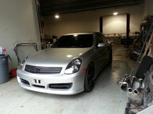 2003 silver infiniti g35 6 speed with custom exhaust bodykit and 19x8 nismo rims