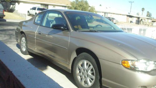 2003 chevy monte carlo *low miles* 38k gold very good cond. clean history