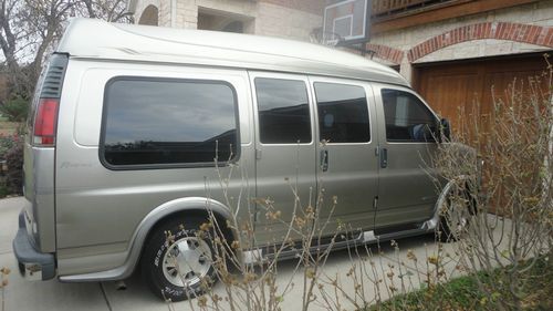 2002 conversion van, good condition, silver, one owner, dvd, tv