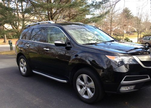 2010 acura mdx awd black with tan leather. dual dvd perfect family car