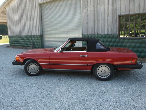 Red mercedes 1988 560 sl in good condition with all documentation since purchase