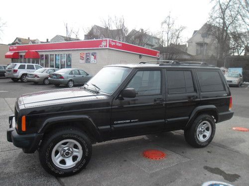 Cherokee sport! excellent 4x4 black low miles! great suv! no reserve