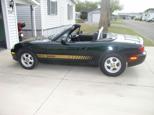 Restored mx-5, 73,000 miles, new leather interior, new top, cold air.