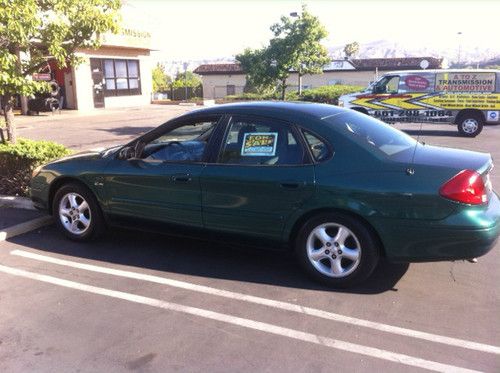 V6 3.0l, power windows, power seats, a/c, alloy wheels, green, car is great cond
