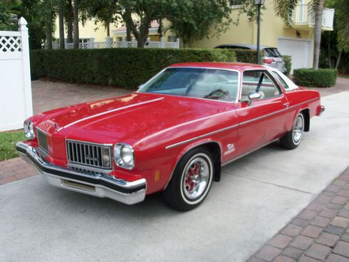 1975 red oldsmobile carolina cutlass 2 door coupe 20,690 original miles