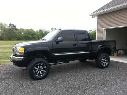 Black lifted 2006 gmc sierra extended cab, excellent condition