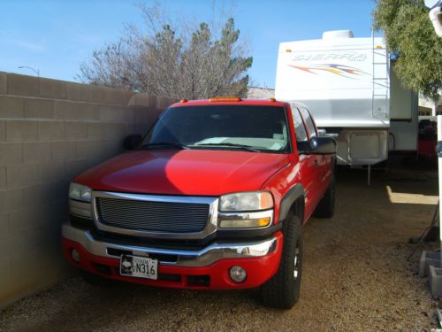 Victory red loaded sierra crew cab, excellent condition new tires.