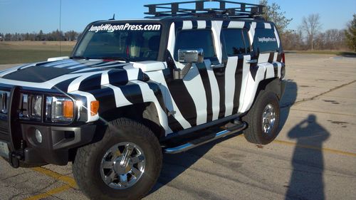 One of a kind custom zebra striped 2006 hummer h3 black and white or solid red