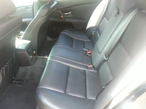 2006 bmw 525i with 90,700 miles. the car is black on black with chrome trim