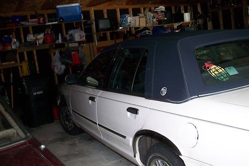 1998 4 door white with navy roof,79,000miles,needs new front right headlight