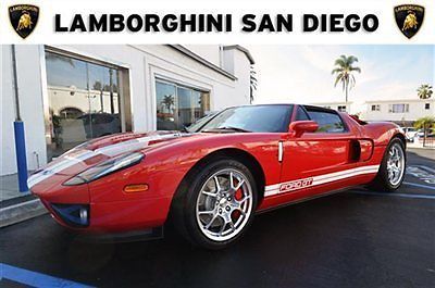 2006 ford gt. 44 delivery miles. red with white stripes. black interior.